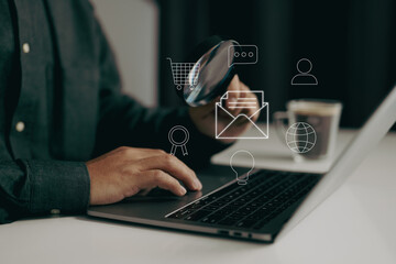 Fototapete - person using a laptop with a magnifying glass, examining various icons such as email, shopping cart, and user profile. It symbolizes the analysis and management of digital communication and e-commerce
