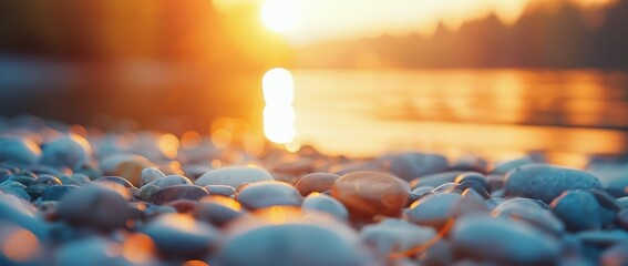 Wall Mural - Serene Sunset Over Pebbled Shoreline With Reflective Water