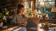© Ameer - Remote work concept: Woman teleworker working from home on a laptop, focused on a business project, in a modern and cozy home office setting with a productive atmosphere.