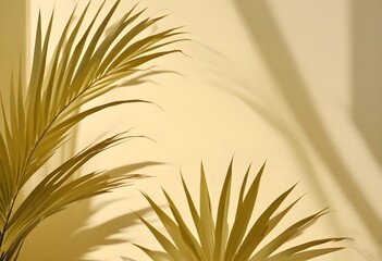 Wall Mural - A close-up shot of two yellow palm leaves against a pale yellow background. The leaves are backlit by sunlight, casting shadows and creating a tropical and summery feel.