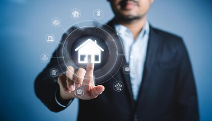 Real estate investment concept: man selects virtual house icon on screen for mortgage loan analysis, insurance, interest rate, investment planning.