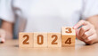 © Logo - The image features a wooden block with '2025,' highlighting business targets and budget planning for future growth.