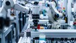 © Mnt - A close-up view of industrial robots working seamlessly on an automated assembly line in a modern manufacturing facility.