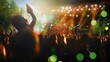 © Felippe Lopes - A young man in the crowd at a concert raises his hands in the air as the band performs on stage.