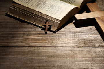 Wall Mural - Bible and crosses on wooden table, space for text. Religion of Christianity