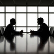 © Renee - Two men sit across from each other at a conference table. Realistic indoor office photo with businessmen in dark colors