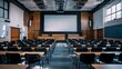 © amorn_m - Empty Lecture Hall with Projector Screen.
