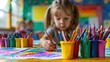 © เลิศลักษณ์ ทิพชัย - Children in kindergarten at school use their imaginations to paint in vibrant colors. When painting on drawing paper, the kids use water or crayons.