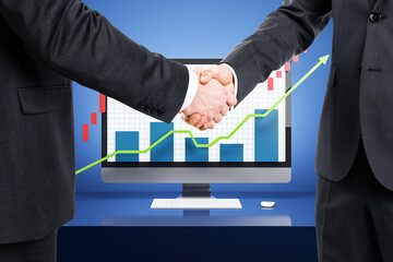 Wall Mural - Businessmen shaking hands in front of a computer screen with upward growth charts.