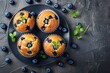 © Maryam - Beautiful blueberry muffins on a black background