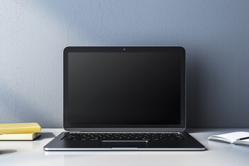 Canvas Print - Modern laptop with blank screen on a desk, books and notebook beside it. 3D Rendering