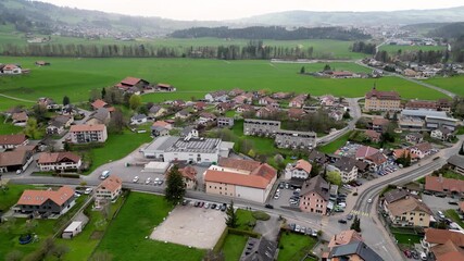 Wall Mural - Village of Gruyere in Switzerland - aerial view by drone