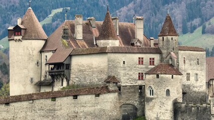 Wall Mural - Famous Gruyere Castle in Switzerland also called Schloss Greyerz - aerial view by drone