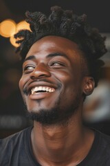 Wall Mural - A man with a big smile on his face. He is wearing a black shirt and has a beard