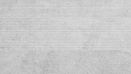 Aufkleber - A grey and white striped wall with a lot of texture. The wall is very plain and has a lot of lines as background.