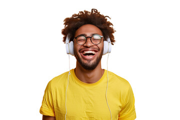 Wall Mural - Young ethnic man with glasses wearing headphones and a yellow t-shirt, laughing , Isolated on white background