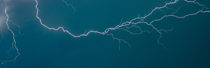 Wall Mural - a thunderbolt of lightning cleaves the skies in the night