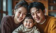 © Crafters Art - Portrait of a Korean family with parents and their young toddler kid at happy home, Generative AI