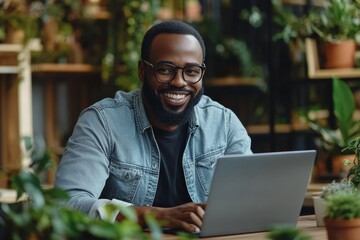 Happy entrepreneur working on laptop at modern office table, Generative AI