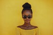 © robertuzhbt89 - Stylish Woman in Sunglasses Against Yellow Background