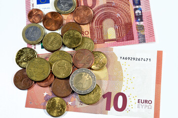 Background of European money banknotes and coins of 10 Ten euros and coins of 1, 2 euros, 50 cents, 20, 10, 5, 2 and 1 cent, European Union money inflation. growth and economic values concept