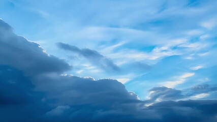 Wall Mural - The rain clouds slowly part revealing a burst of vibrant blue sky as the storm passes by.