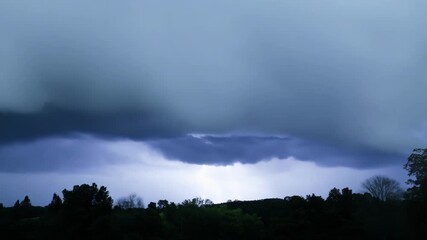 Wall Mural - the air becomes heavy and oppressive as the sky grows darker signaling a powerful storm approaching.