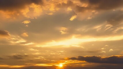 Wall Mural - As the evening approaches the fading light casts a final farewell upon the clouds them in a warm golden glow.