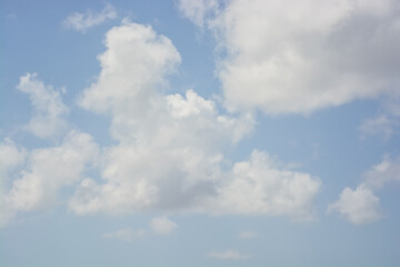 Fluffy white clouds on blue sky background during day . 