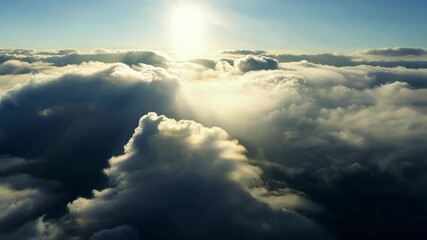 Poster - The mesmerizing dance of light and shadows as the sun tries to peek through the towering storm cells.