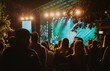 © Alina  - concert with a crowd of people who came to watch the event in the evening in Estonia