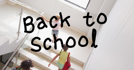 Wall Mural - Image of back to school text over happy diverse schoolchildren running up stairs at school