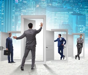 Wall Mural - Businessman in uncertainty concept with many doors