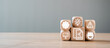 © Satori Studio - Wooden blocks with icons representing audit concepts such as compliance, risk management, and business analysis on a wooden table.