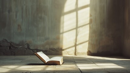 Canvas Print - An open book on a tile floor in a room with a window casting light.