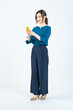 © metamorworks - Full-body photo of a Caucasian female  business person using a smartphone in front of a white background