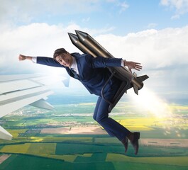 Wall Mural - Businessman flying next to commercial flight