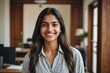 © ThomasLENNE - Cheerful beautiful indian girl student professional standing at home in office looking at camera, happy confident entrepreneur hindu lady laughing face posing alone, head shot close up view portrait