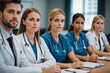 © ThomasLENNE - Portrait of a young doctors and nurses in audiance during a seminar in a board room or during an educational class at convention center