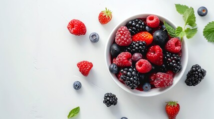 Wall Mural - A bowl of mixed berries on a white background.