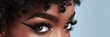 © The 2R Artificiality - African American woman with focused gaze wearing trendy makeup and eyelash extensions