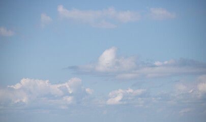 Wall Mural - White clouds on blue sky, cloudy sky background.