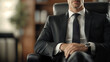 © Wimstock - Serious Businessman in Suit Sitting at Desk in Corporate Office with Laptop Computer