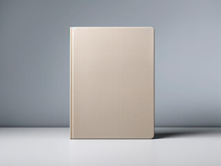 Wall Mural - A blank beige book mockup standing upright on a grey gradient background, concept of branding identity. Generative AI