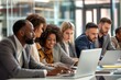 © Viktor - Diverse group of professionals collaborate in modern office. Businessmen and businesswomen work together, discuss ideas. Colleagues use laptops, tablets for team projects. Multicultural workforce.