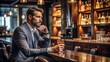 © Ole Studio - Man sitting at a bar with a glass of drink in hand, man, bar, alcohol, casual, relaxed, social, nightlife, happy hour