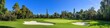 © Lu - Scenic Coastal Golf Course in Need of Repair: Lush Greens, Flagsticks, and Bunkers Under Clear Blue Skies - Perfect Setting for Outdoor Sports and Summer Leisure, Featuring a Prominent Divot Awaiting
