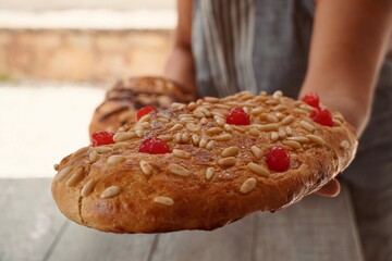 Woman baker with freshly baked St. John's cake.