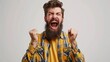 © Boraryn - Portrait of overjoyed bearded man standing with excited expression, raising fists, screaming, shouting yeah, celebrating his victory, success