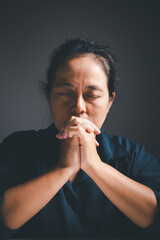 Poster - Woman raises her hand in prayer, with deep faith in God, worshiping Jesus Christ in a moment of holy peace and devotion. woman, hand, pray, faith, religion, jesus christ, christian, god, holy.